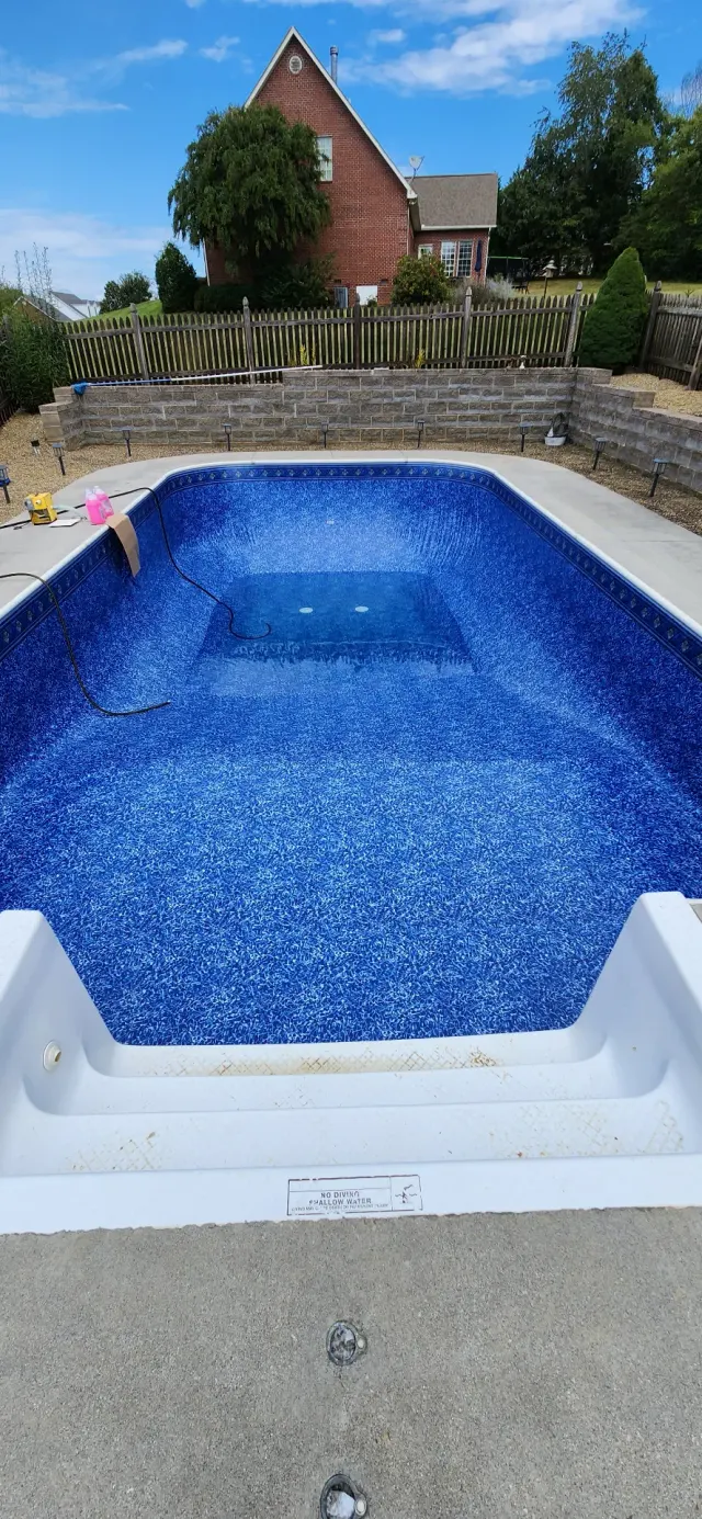 Custom inground vinyl liner pool in Maryville TN with stone retaining wall